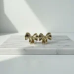 Chic Gold Double Bow Stud Earrings - Image 3