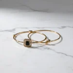 Stylish Gold Bracelets: Black Zirconia & Bell Charms - Image 2